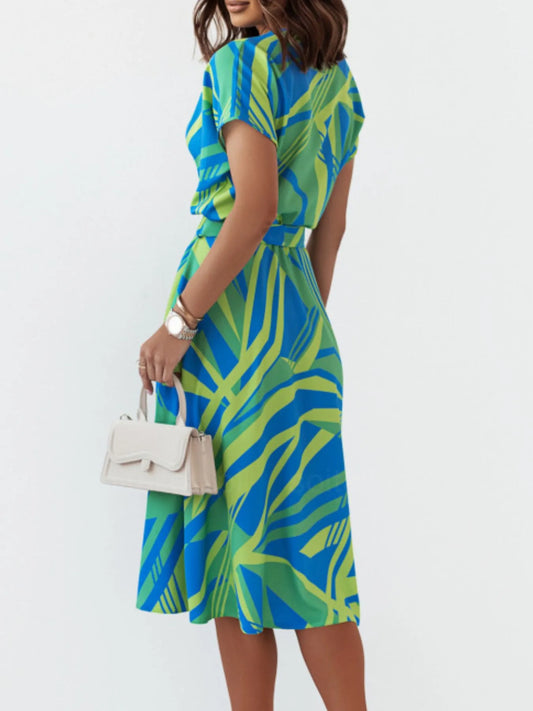 Abstract print belted midi dress from Marigold Collections Australia, featuring a stylish, flowy design with a waist belt.