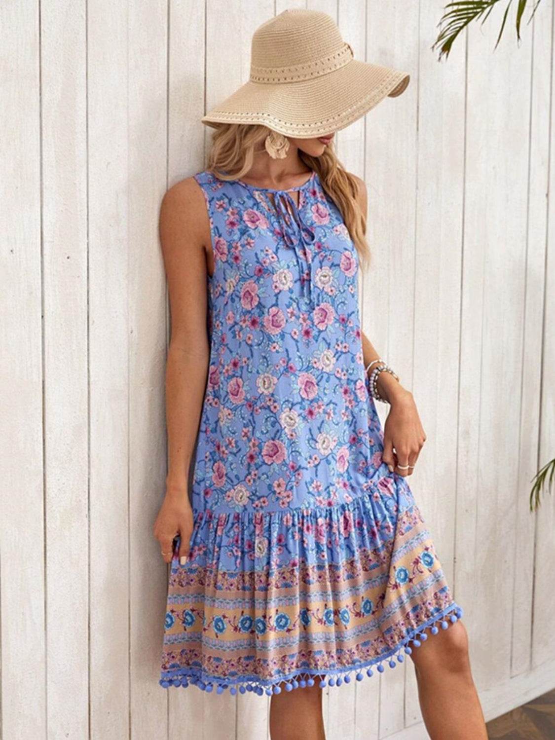 Floral Print Blue Sleeveless Dress with Tie Neck & Pom-Pom Hem - MARIGOLD