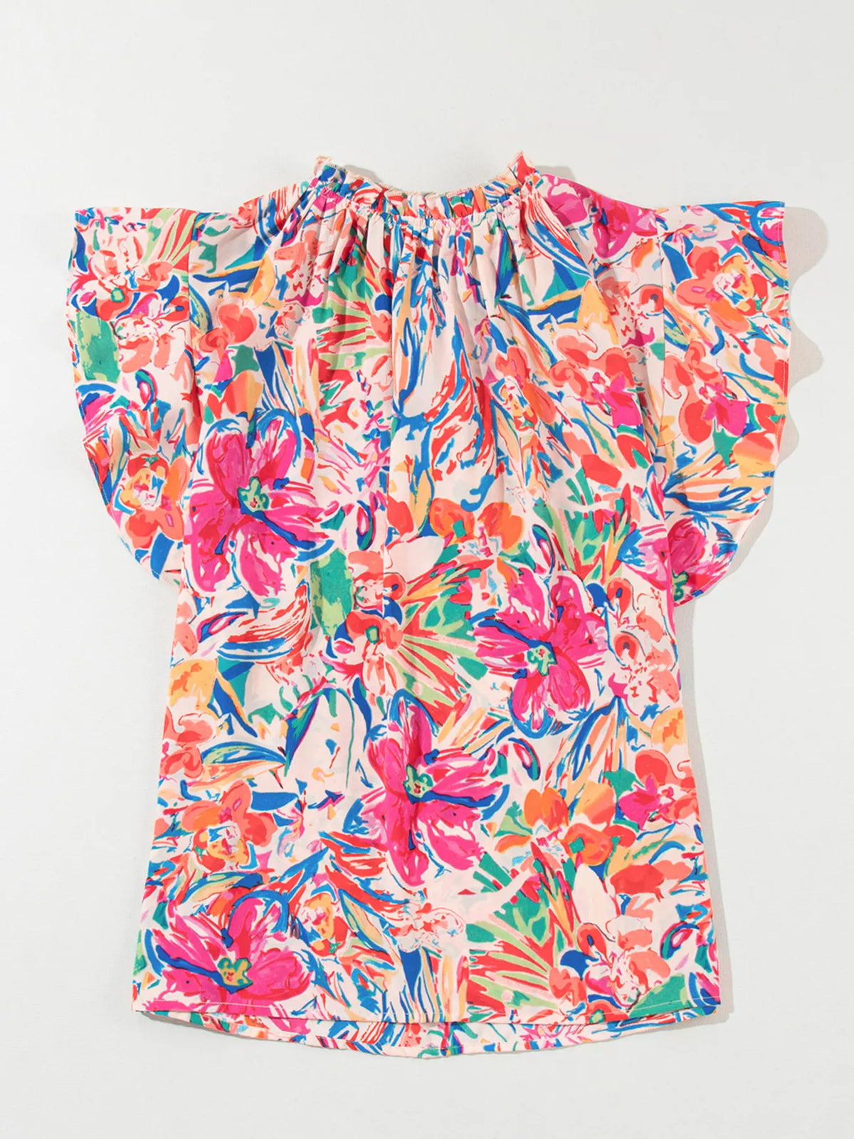 Multicolour floral ruffled sleeve V-neck summer blouse by Marigold Collections Australia, featuring vibrant floral patterns and feminine ruffles.