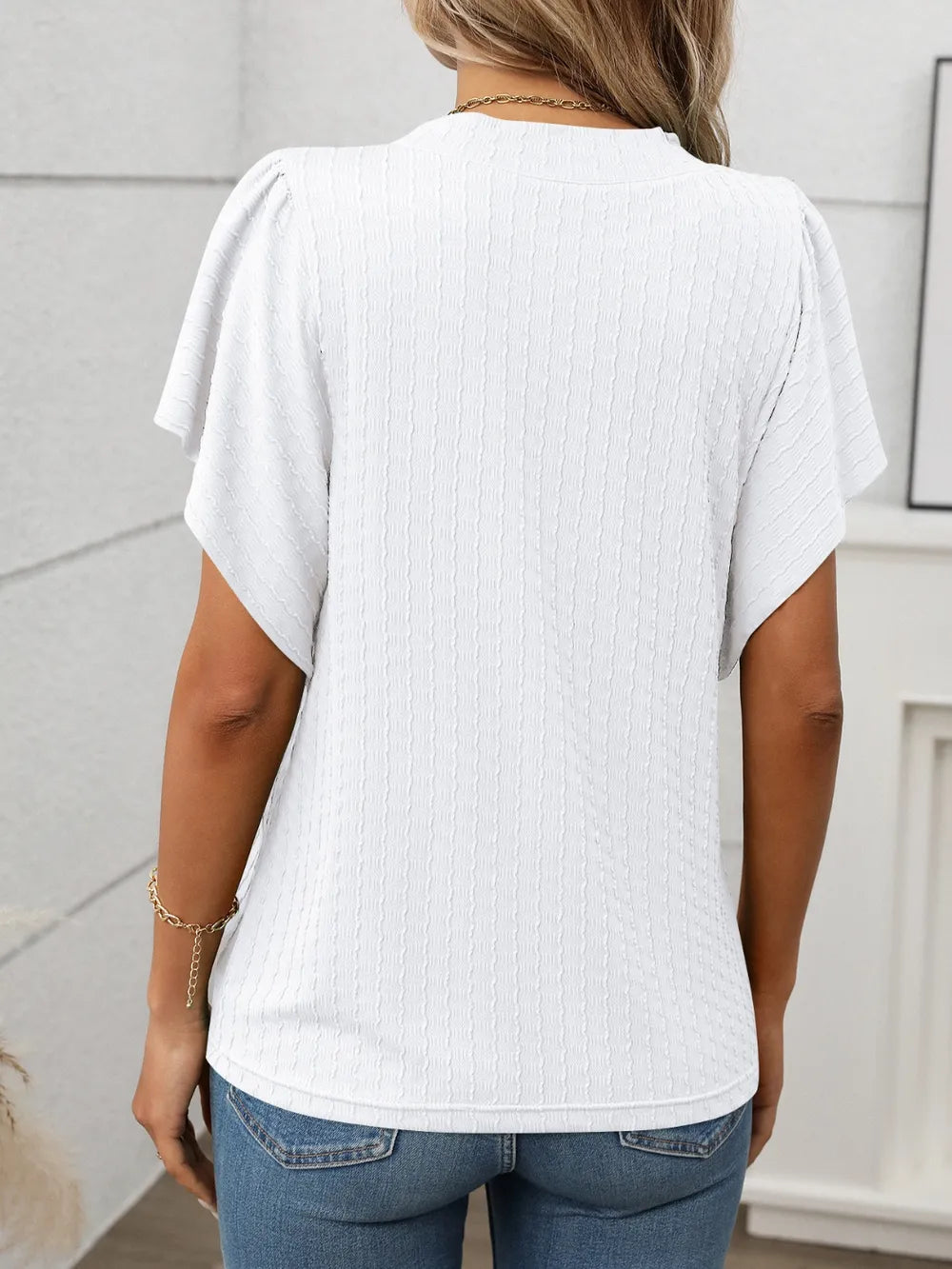 Marigold Collections Australia round neck flutter sleeve top in soft fabric, featuring a relaxed fit and elegant design.