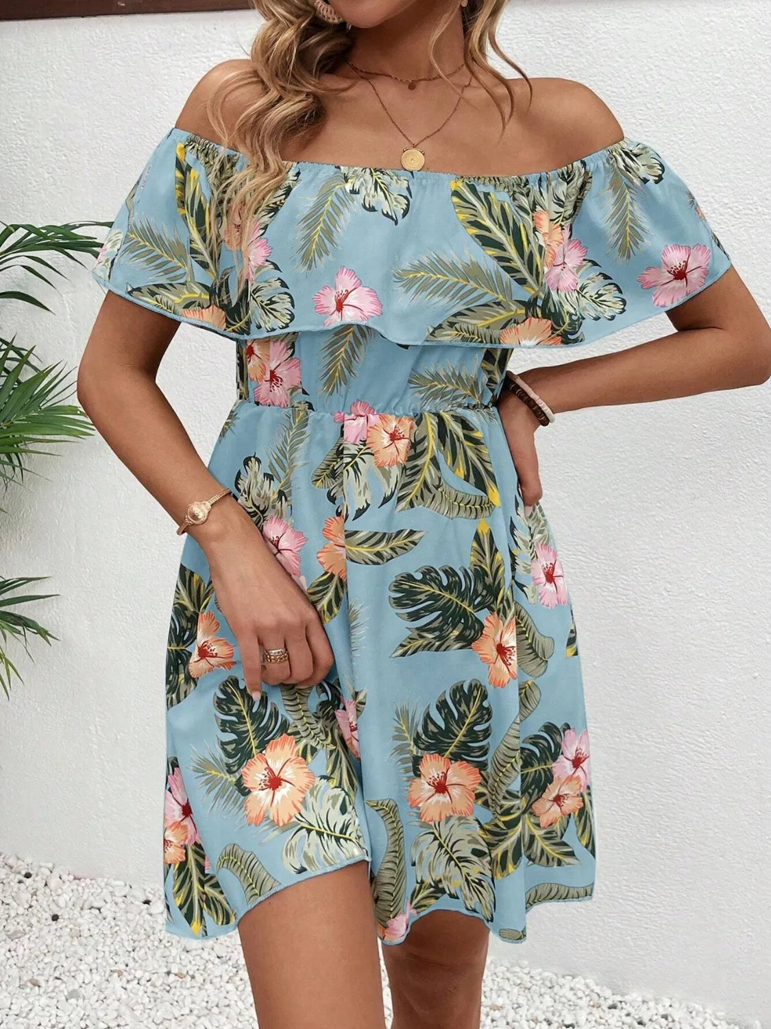 Tropical print off shoulder mini dress by Marigold Collections Australia with vibrant floral pattern and relaxed fit.