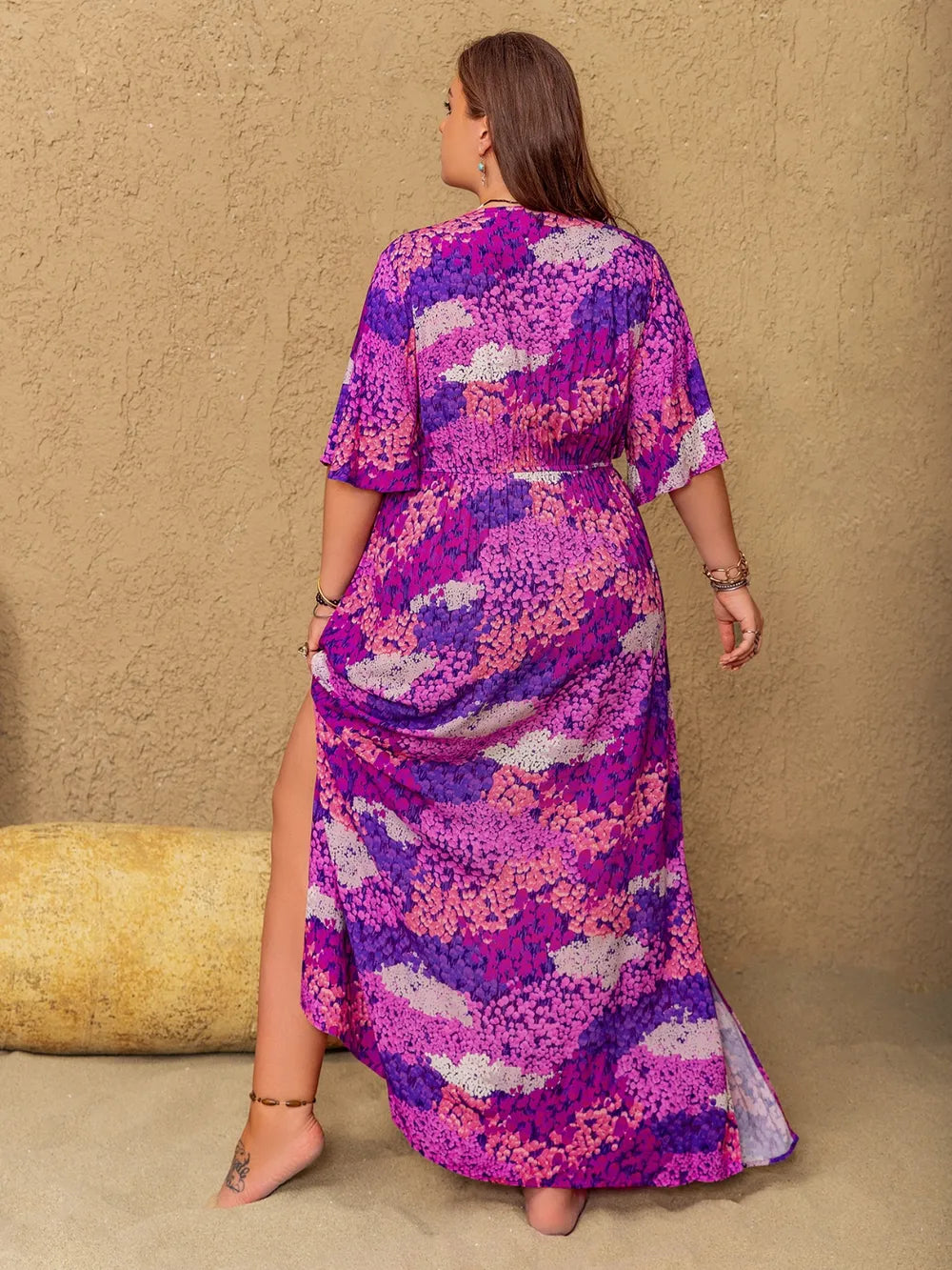 Vivid violet boho floral maxi dress from Marigold Collections Australia, flowing design with vibrant floral patterns, perfect for summer.
