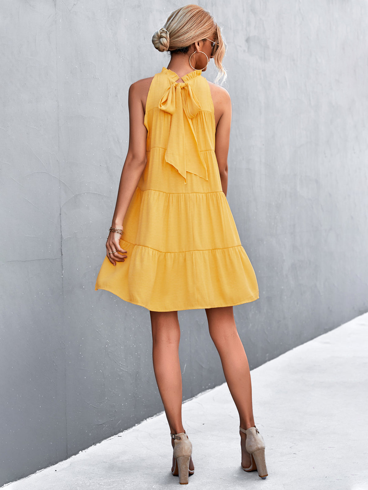 Marigold Collections Australia high-neck sleeveless tiered mini dress with back tie, elegant summer dress style.