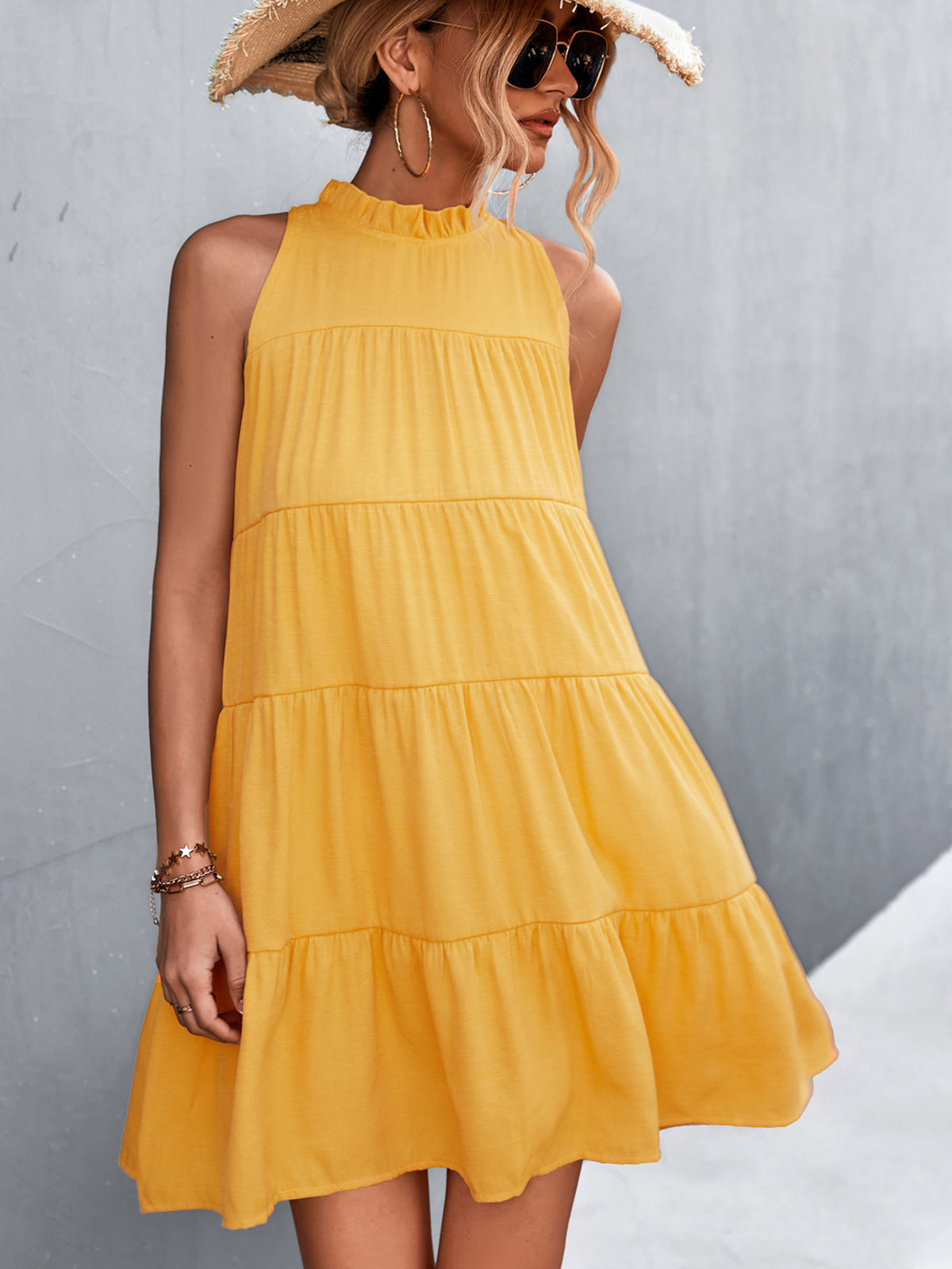Marigold Collections Australia sleeveless tiered dress with high neck and back-tie detail, in a stylish mini dress design.