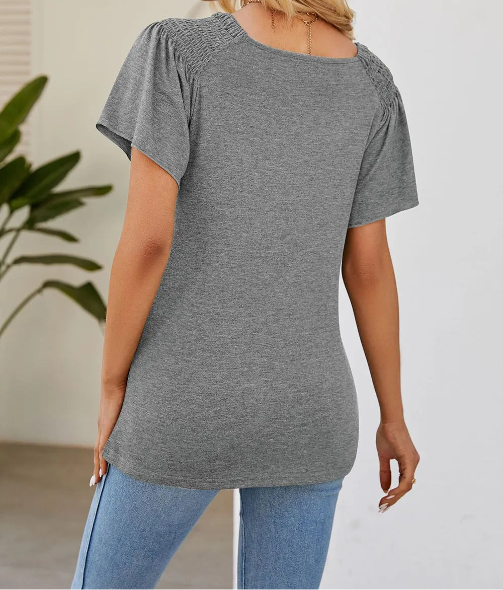 Marigold Collections Australia smocked shoulder flutter sleeve top with relaxed fit, lightweight fabric, and feminine design.