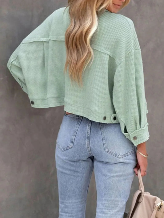 Women's button-up long sleeve shacket by Marigold Collections Australia, featuring a stylish, casual design with front buttons.