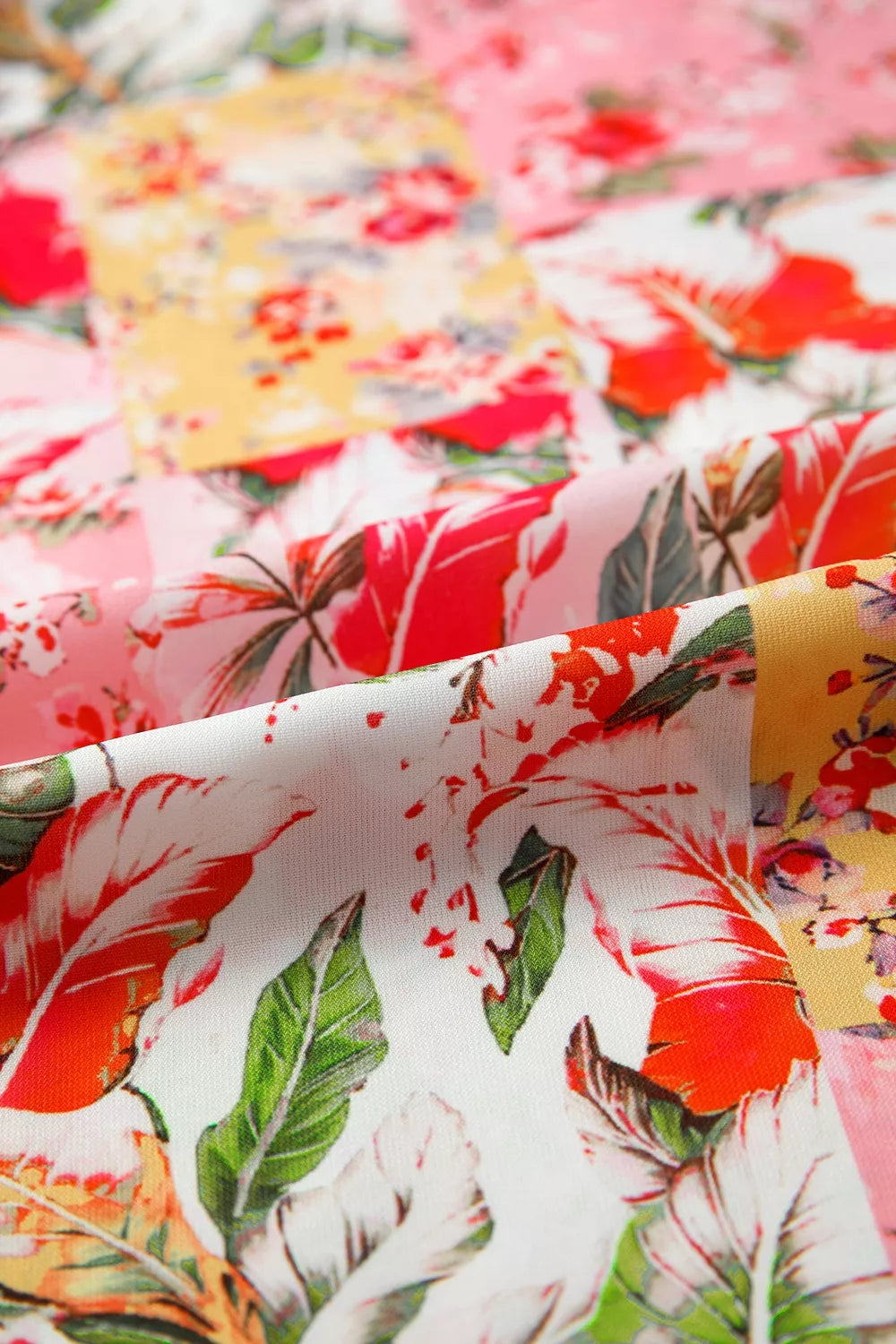 Marigold Collections Australia floral blouse with contrast collar, V neck, short sleeves, and a colorful floral pattern.