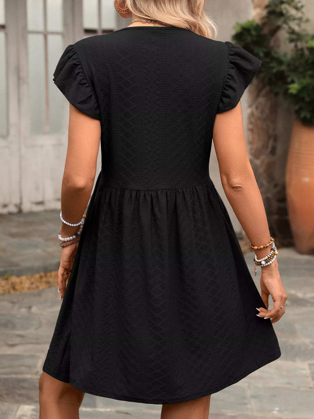 Marigold Collections Australia ruffle sleeve V-neck A-line mini dress with a flowy silhouette and stylish design.