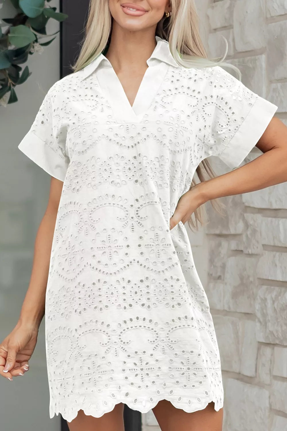 White eyelet mini dress with a collared neckline by Marigold Collections Australia, featuring delicate eyelet details and a fitted silhouette.