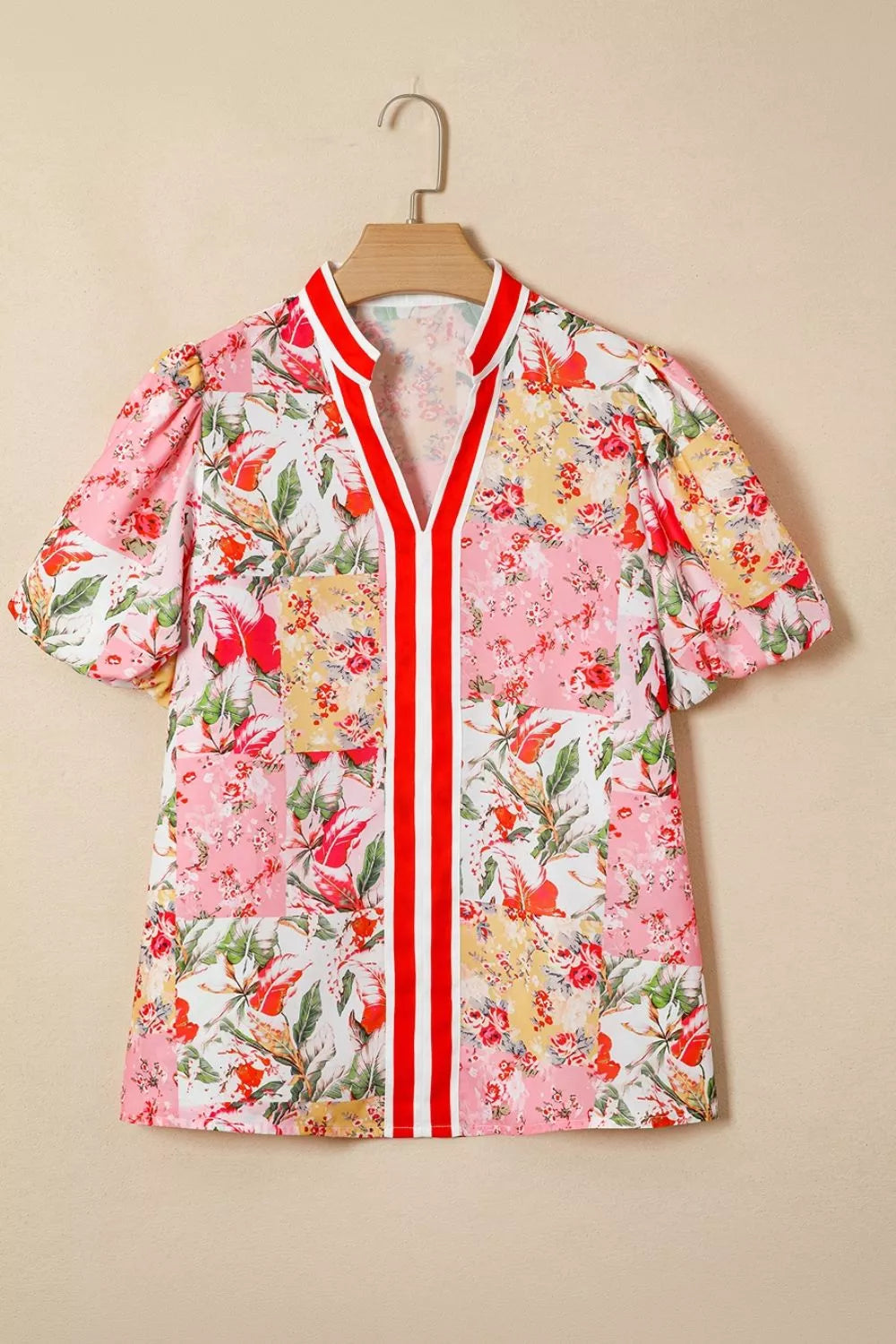 Contrast collared V-neck short sleeve floral blouse from Marigold Collections Australia, featuring a vibrant floral pattern.