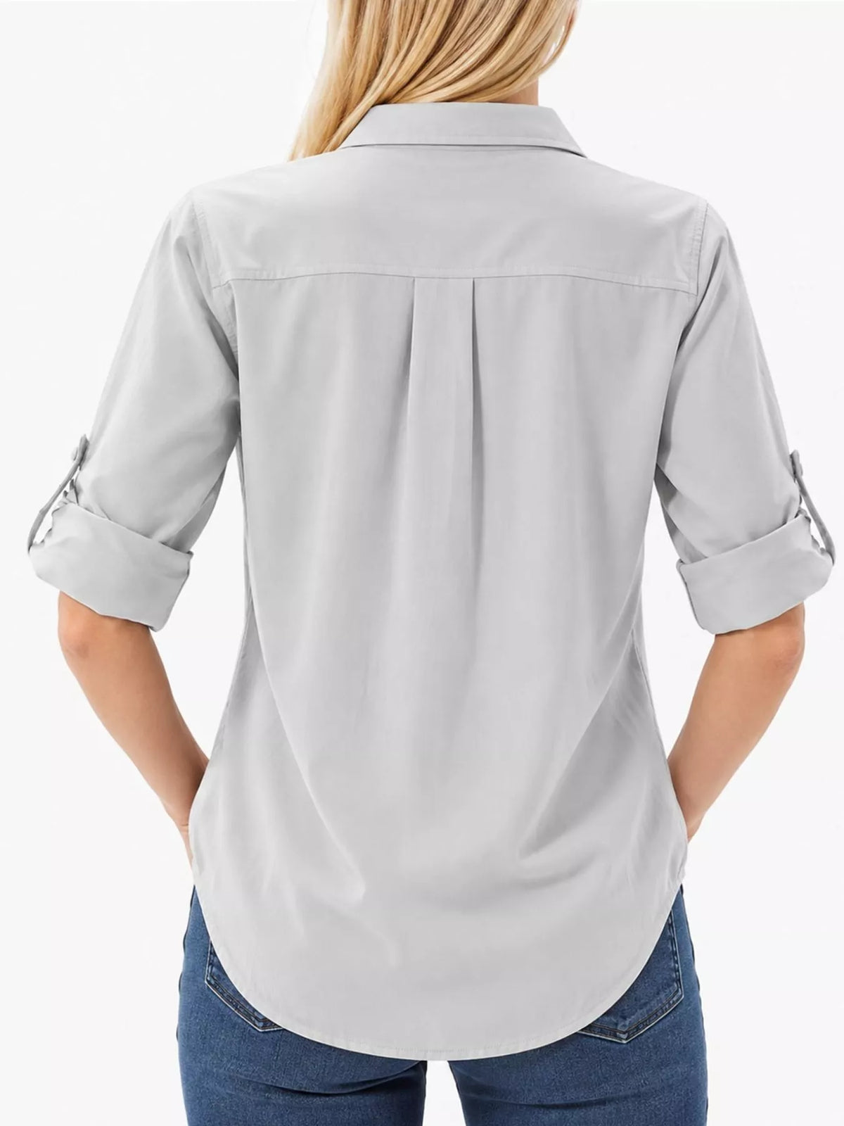 Marigold Collections Australia safari button-down shirt with roll-up sleeves, in a casual, lightweight design, shown in a natural outdoor setting.