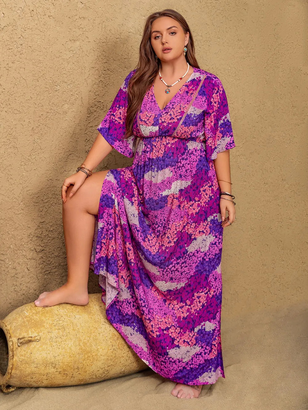Vivid violet boho floral maxi dress from Marigold Collections Australia featuring flowing fabric and a vibrant floral pattern.