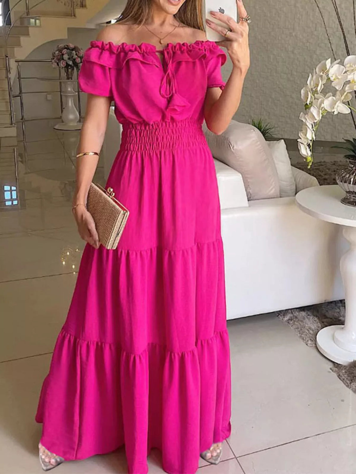 Off-shoulder ruffled tiered maxi dress by Marigold Collections Australia, featuring flowing fabric and layered ruffle details.