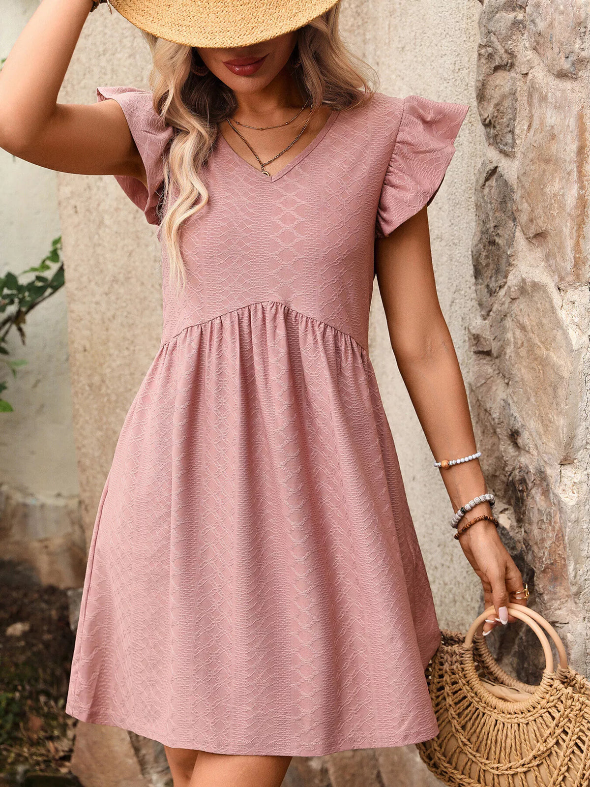 Marigold Collections Australia ruffle sleeve V-neck A-line mini dress on a model, showcasing feminine style and flowy fabric design.