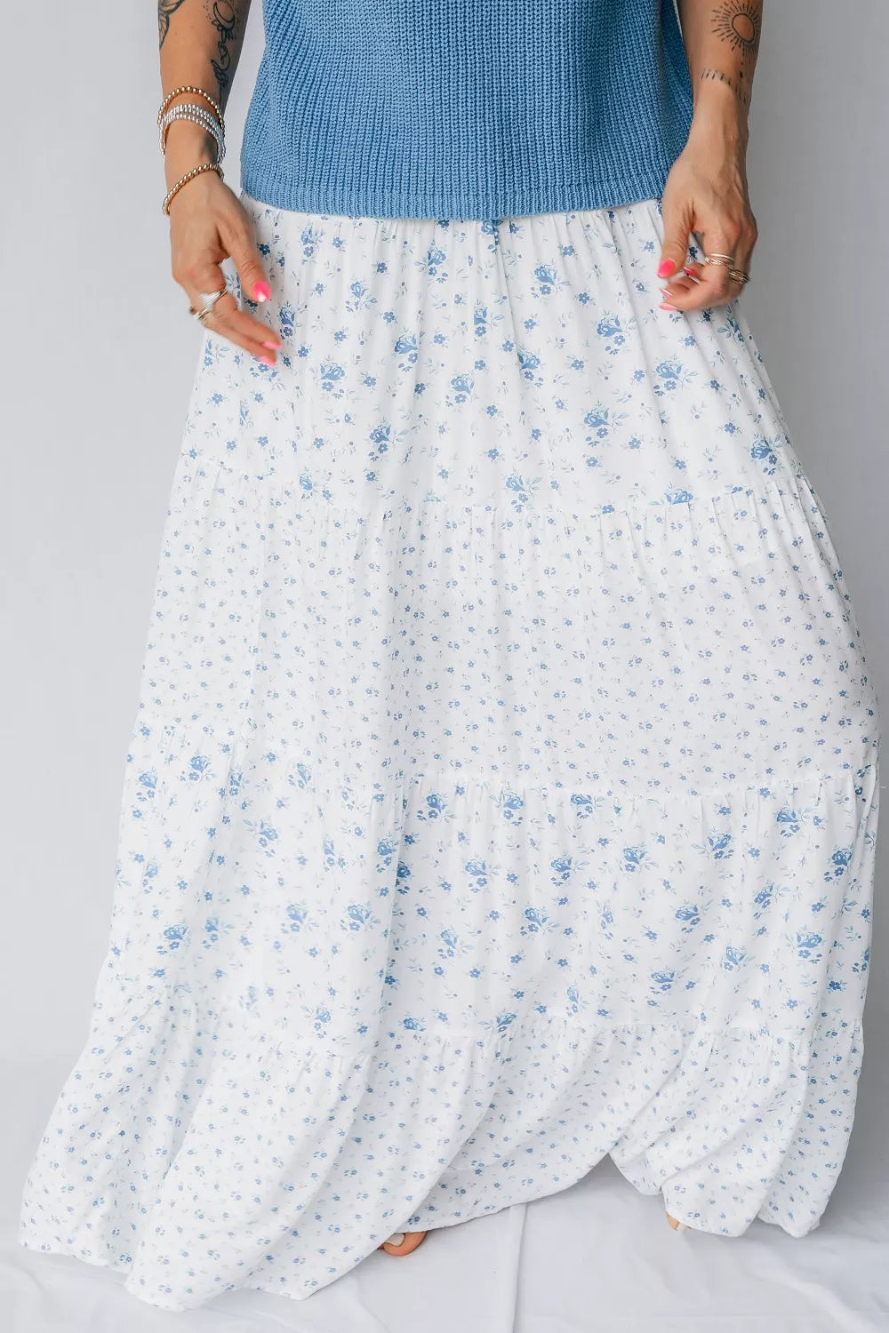 Blue floral tiered maxi skirt from Marigold Collections Australia featuring a flowing design and vibrant floral pattern.