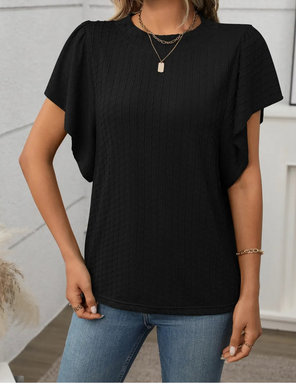 Marigold Collections Australia round neck flutter sleeve top in soft fabric, showcasing elegant flutter sleeves and a relaxed fit.