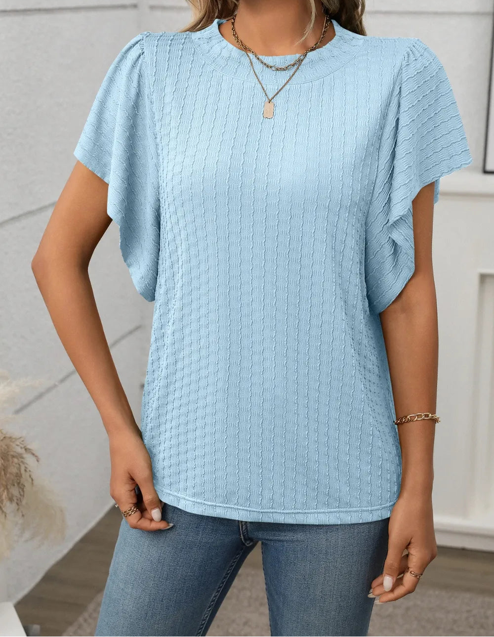 Marigold Collections Australia round neck flutter sleeve top in soft fabric, featuring a relaxed fit and elegant design.