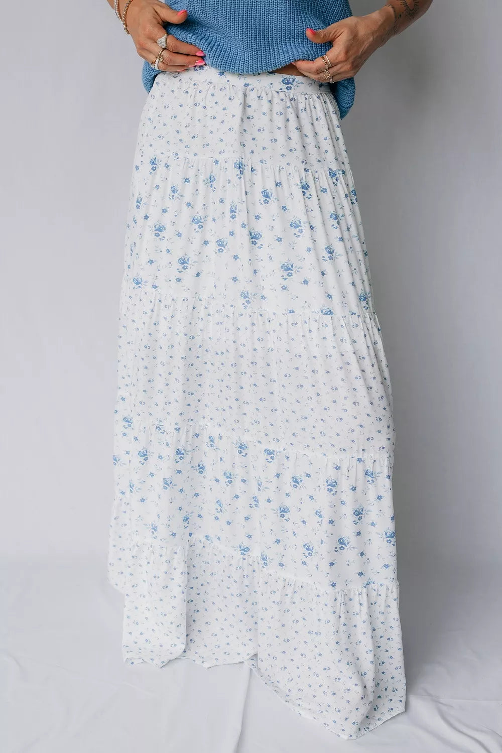 Blue floral tiered maxi skirt from Marigold Collections Australia featuring flowing fabric and layered design.