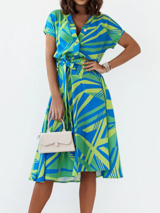 Abstract print belted midi dress from Marigold Collections Australia featuring a stylish design and waist tie detail.