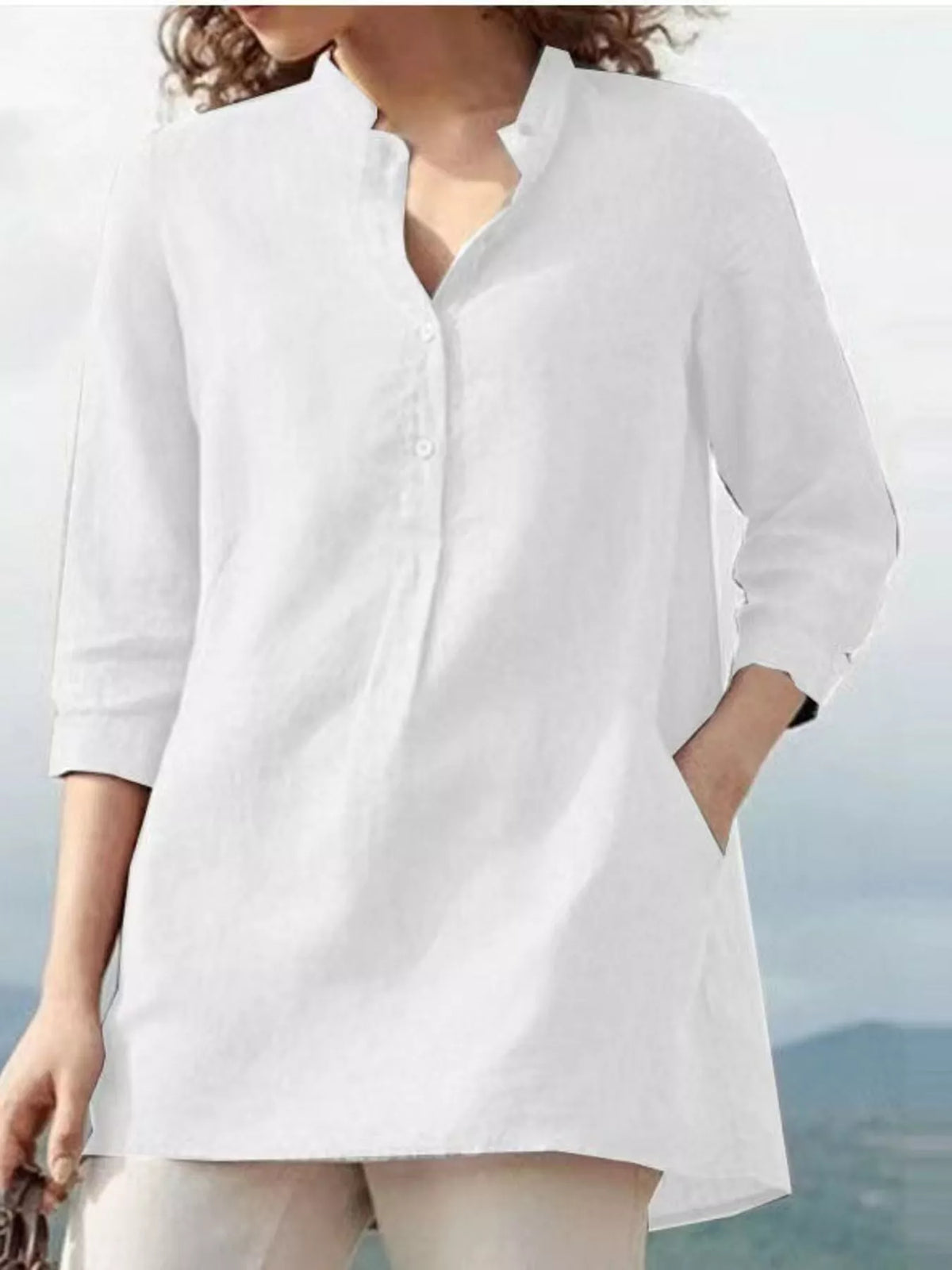 White half-button blouse with pocket and 3/4 sleeves from Marigold Collections Australia, suitable for casual or office wear.
