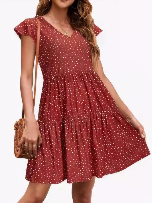 Polka dot ruffle sleeve V-neck mini dress by Marigold Collections Australia, featuring a stylish design and playful pattern.