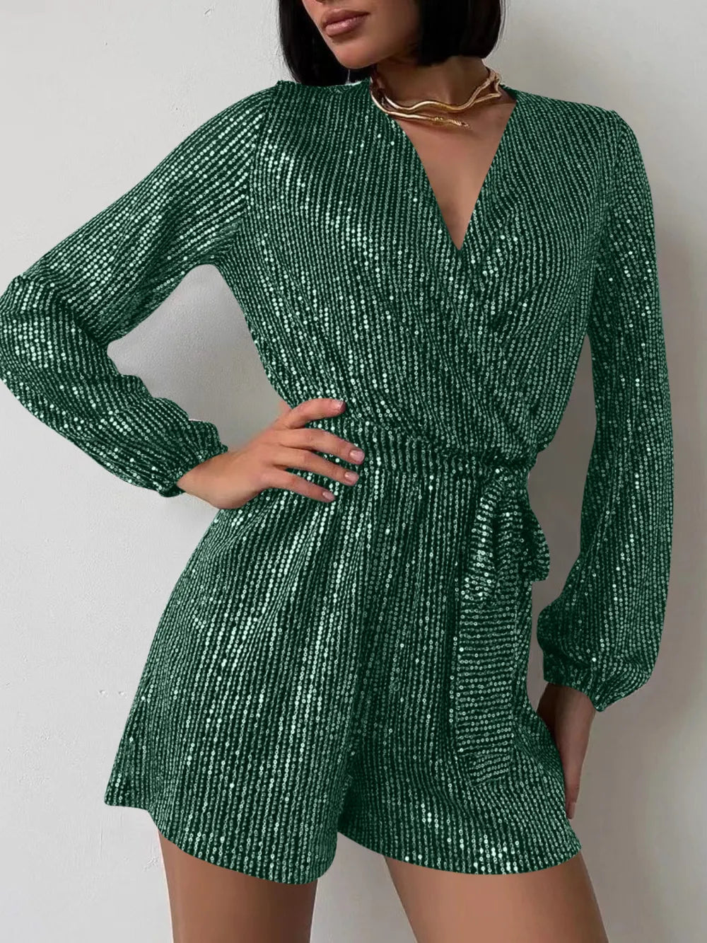 Green women's sequin long sleeve romper, a stylish formal jumpsuit by Marigold Collections Australia, perfect for evening events.