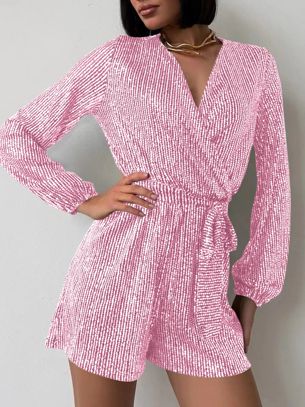 Pink sequin long sleeve romper for women, stylish evening playsuit or jumpsuit from Marigold Collections Australia.