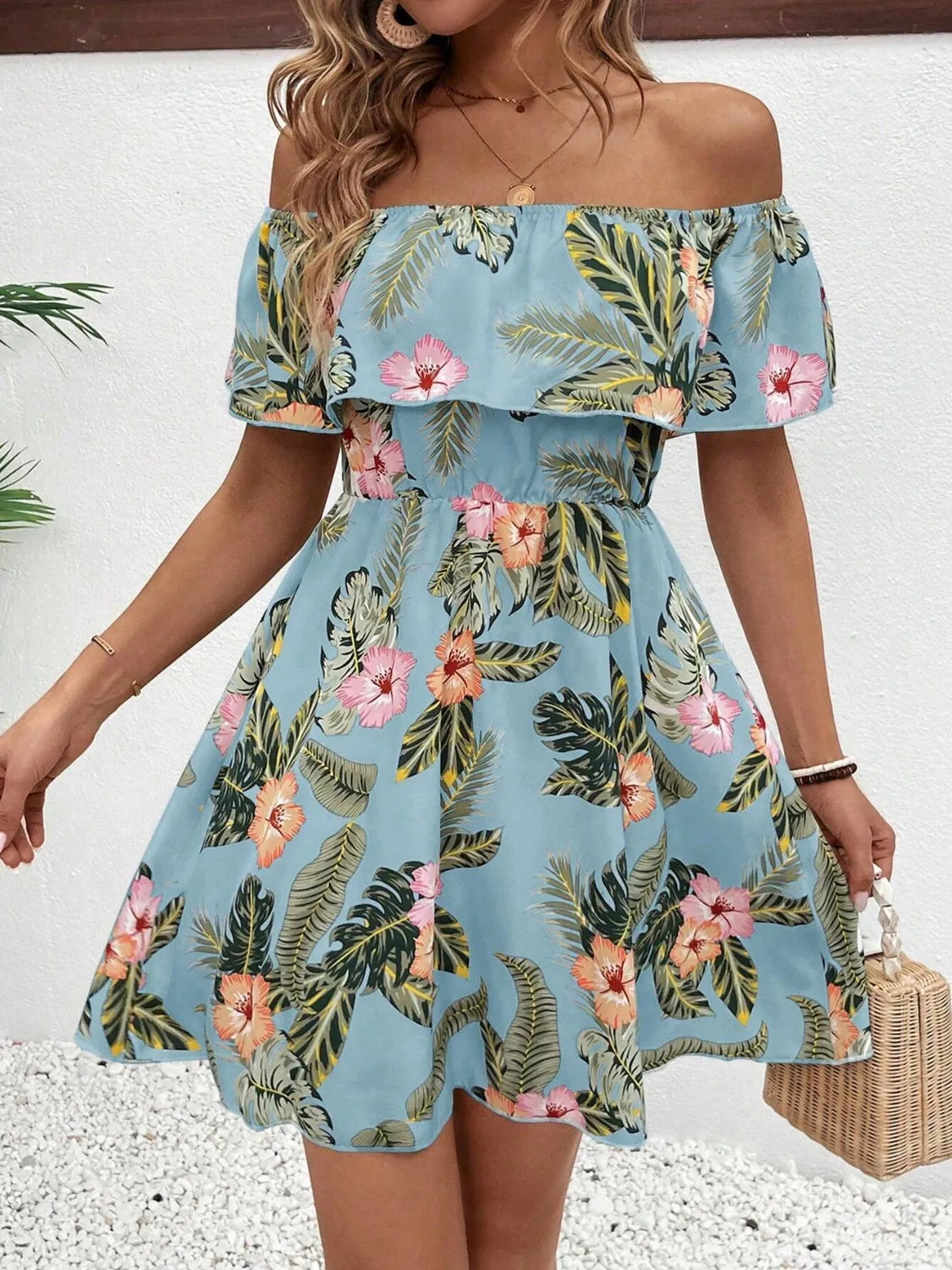 Tropical print off-shoulder mini dress by Marigold Collections Australia featuring vibrant floral design and lightweight fabric.