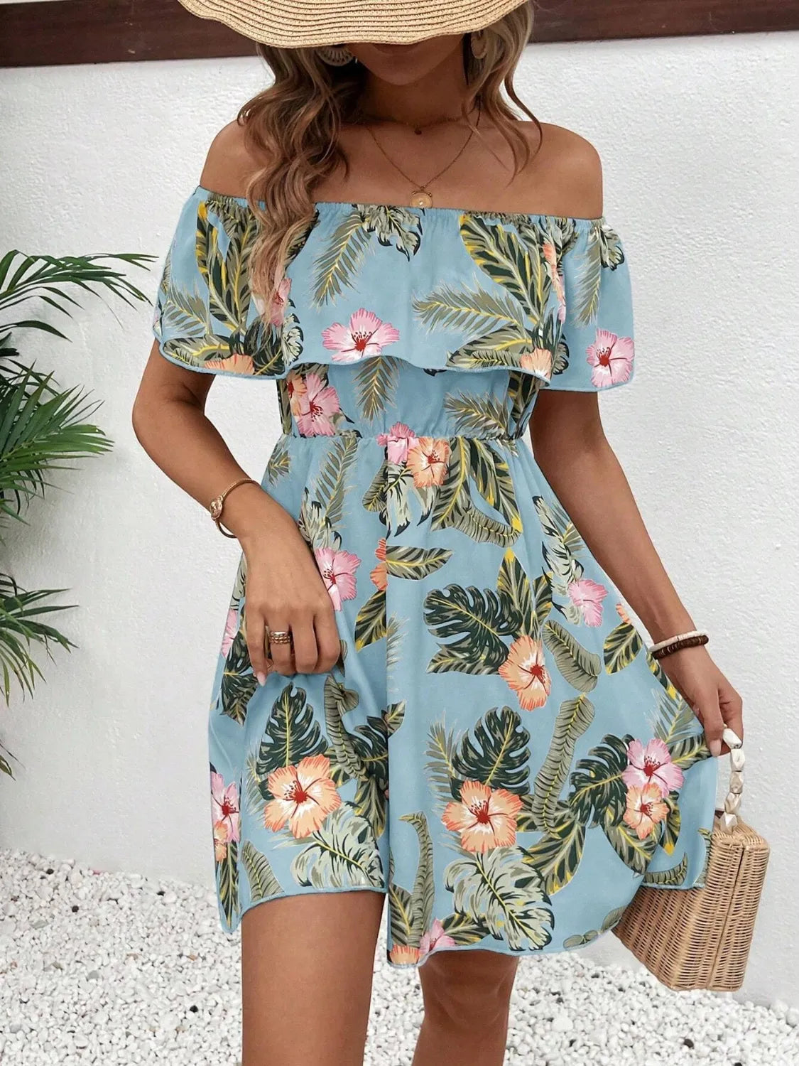 Tropical print off-shoulder mini dress by Marigold Collections Australia featuring vibrant floral patterns and lightweight fabric.
