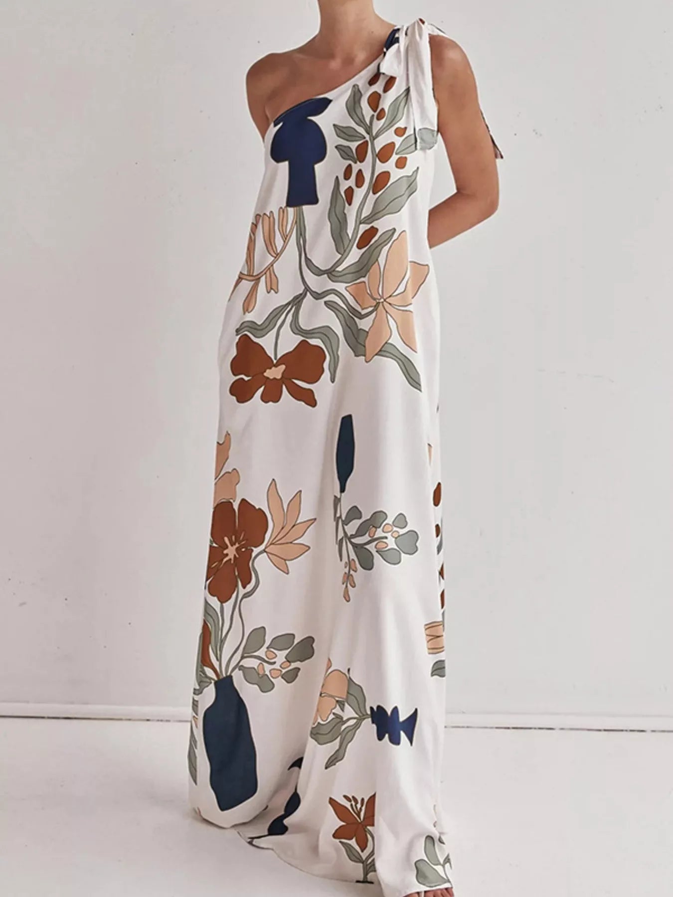 Tall modern floral print one-shoulder maxi dress from Marigold Collections Australia, featuring vibrant floral patterns and elegant design