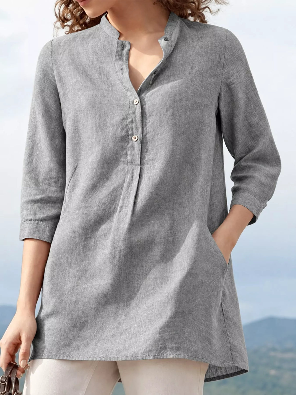 Marigold Collections Australia half button pocketed 3/4 sleeve blouse with front pockets and a relaxed fit, displayed on a white background.