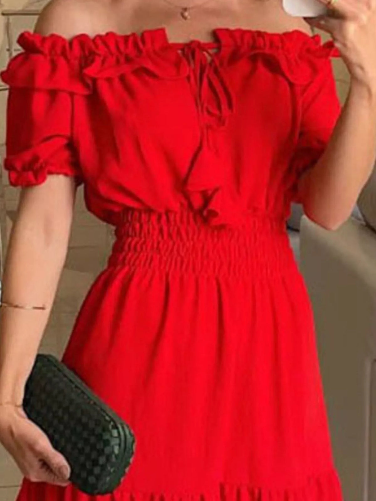Off-shoulder ruffled tiered maxi dress by Marigold Collections Australia featuring flowing fabric and layered ruffle details.