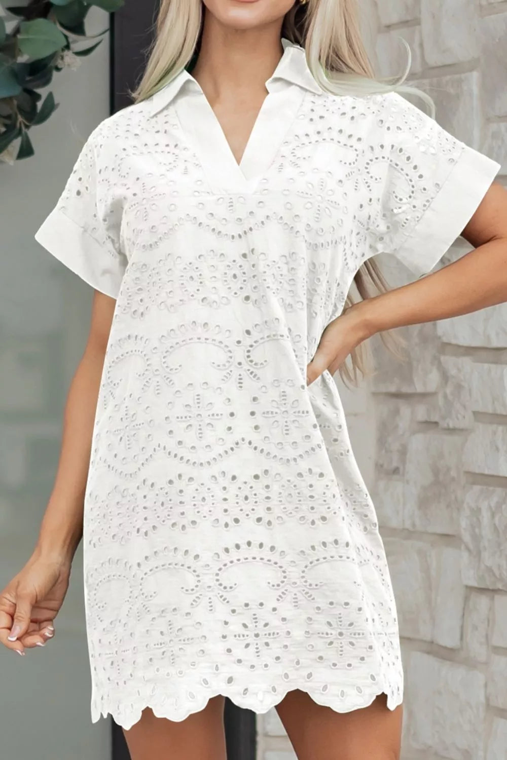 White eyelet collared mini dress by Marigold Collections Australia, featuring a fitted silhouette and delicate eyelet detailing.