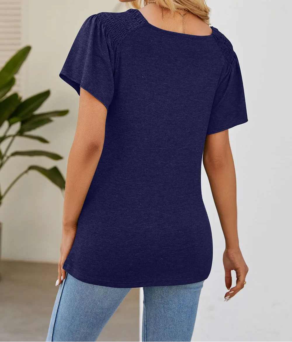 Marigold Collections Australia smocked shoulder flutter sleeve top featuring lightweight fabric and feminine design.