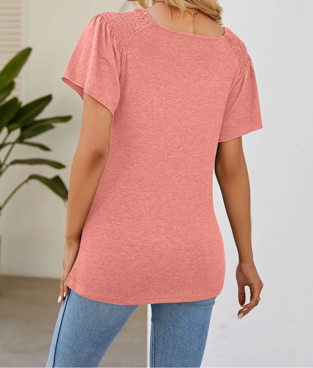 Marigold Collections Australia smocked shoulder flutter sleeve top, light fabric with feminine design, displayed on a model.
