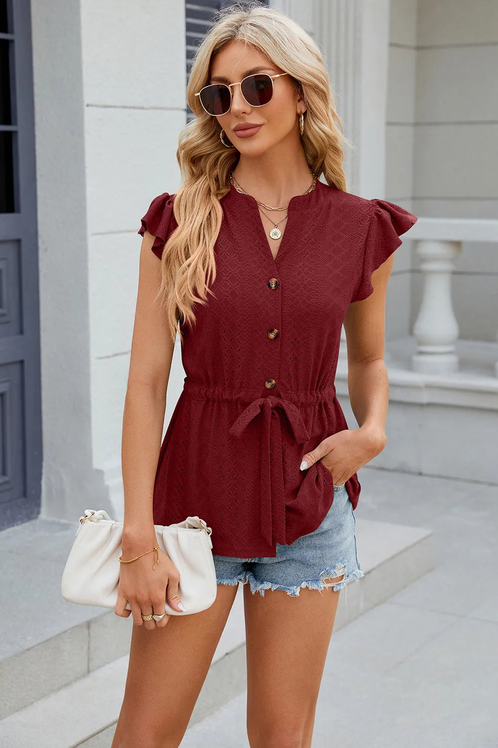 Marigold Collections Australia eyelet notched cap sleeve blouse with stylish design, featuring eyelet details and a notched neckline.