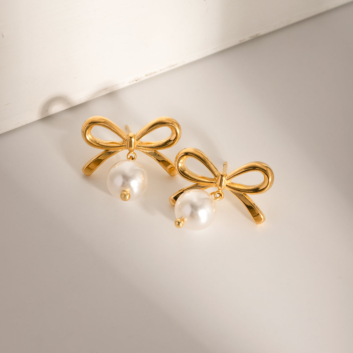 Elegant Bow Faux Pearl Stainless Steel Earrings - MARIGOLD 